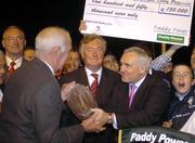 18 September 2004; An Taoiseach Bertie Ahern T.D. presents the trophy to Michael Kelly after Like A Shot won the Paddy Power Irish Greyhound Derby, Shelbourne Park, Dublin. Picture credit; Pat Murphy / SPORTSFILE