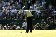 19 September 2004; Colin Montgomerie takes the final putt on the 18th green after Europe had won the Ryder Cup. 35th Ryder Cup Matches, Oakland Hills Country Club, Bloomfield Township, Michigan, USA. Picture credit; Matt Browne / SPORTSFILE
