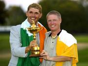 19 September 2004; Padraig Harrington and his caddy Ronan Flood, right, pictured with the Ryder Cup. 35th Ryder Cup Matches, Oakland Hills Country Club, Bloomfield Township, Michigan, USA. Picture credit; Matt Browne / SPORTSFILE
