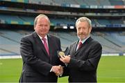 11 October 2013; Former GAA President Sean Kelly MEP, right, presents Uachtarán Chumann Lúthchleas Gael Liam Ó Néill with the European Citizen's medal after the Gaelic Athletic Association was announced as winner of the European Citizen's Prize 2013. Croke Park, Dublin. Picture credit: Matt Browne / SPORTSFILE