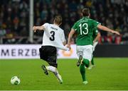 11 October 2013; Anthony Stokes, Republic of Ireland, pulls back the jersey of Marcell Jansen, Germany. 2014 FIFA World Cup Qualifier, Group C, Germany v Republic of Ireland, Rhine Energie Stadion, Cologne, Germany. Picture credit: David Maher / SPORTSFILE