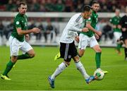 11 October 2013; Mesut Ozil, Germany, scores his side's third goal. 2014 FIFA World Cup Qualifier, Group C, Germany v Republic of Ireland, Rhine Energie Stadion, Cologne, Germany. Picture credit: David Maher / SPORTSFILE