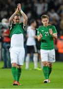 11 October 2013; Glenn Whelan, left, and Kevin Doyle, Republic of Ireland, at the end of the game. 2014 FIFA World Cup Qualifier, Group C, Germany v Republic of Ireland, Rhine Energie Stadion, Cologne, Germany. Picture credit: David Maher / SPORTSFILE
