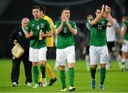 11 October 2013; Republic of Ireland players, from left to right, Ciaran Clark, James McCarthy and Stephen Kelly at the end of the game. 2014 FIFA World Cup Qualifier, Group C, Germany v Republic of Ireland, Rhine Energie Stadion, Cologne, Germany. Picture credit: David Maher / SPORTSFILE
