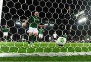 11 October 2013; Ciaran Clark, Republic of Ireland, watches the ball roll into the net after Musut Ozil, Germany, scored his side's third goal. 2014 FIFA World Cup Qualifier, Group C, Germany v Republic of Ireland, Rhine Energie Stadion, Cologne, Germany. Picture credit: David Maher / SPORTSFILE