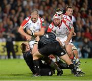 11 October 2013; Iain Henderson, Ulster, is tackled by Dan Cole and Julian Salvi, Leicester Tigers. Heineken Cup 2013/14, Pool 5, Round 1, Ulster v Leicester Tigers, Ravenhill Park, Belfast, Co. Antrim. Picture credit: Oliver McVeigh / SPORTSFILE
