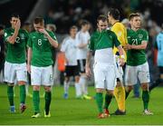 11 October 2013; Glenn Whelan, Republic of Ireland, with, from left, Stephen Kelly, James McCarthy and Kevin Doyle at the end of the game. 2014 FIFA World Cup Qualifier,  Group C, Germany v Republic of Ireland, Rhine Energie Stadion, Cologne, Germany. Picture credit: David Maher / SPORTSFILE