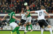 11 October 2013; Kevin Doyle, Republic of Ireland, in action against Philipp Lahm, Germany. 2014 FIFA World Cup Qualifier,  Group C, Germany v Republic of Ireland, Rhine Energie Stadion, Cologne, Germany. Picture credit: David Maher / SPORTSFILE