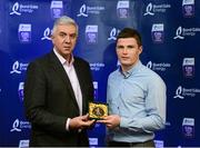 12 October 2013; The right corner back on the inaugural Bord Gáis Energy Under 21 Team of the Year is Paul Flanagan, Clare. The Ballyea clubman was Clare captain and is one of eight Clare players selected on the Team of the Year for 2013 in recognition of their achievement in retaining their All-Ireland crown. Pictured with Paul is Ger Cunningham, Bord Gáis Energy Ambassador and Team of the Year Judge. Bord Gáis Energy All-Ireland GAA Hurling Under 21 Team of the Year Awards, Croke Park, Dublin. Photo by Sportsfile