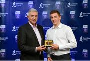 12 October 2013; The full back on the inaugural Bord Gáis Energy Under 21 Team of the Year is David McInerney, Clare. The Tulla clubman was a rock at the back and is one of eight Clare players selected on the Team of the Year for 2013 in recognition of their achievement in retaining their All-Ireland crown. Pictured with David is Ger Cunningham, Bord Gáis Energy Ambassador and Team of the Year Judge. Bord Gáis Energy All-Ireland GAA Hurling Under 21 Team of the Year Awards, Croke Park, Dublin. Photo by Sportsfile
