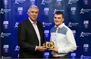 12 October 2013; The right half back on the inaugural Bord Gáis Energy Under 21 Team of the Year is Seadna Morey, Clare. The Sixmilebridge clubman was the 2012 Player of the Year and is one of eight Clare players selected on the Team of the Year for 2013 in recognition of their achievement in retaining their All-Ireland crown. Pictured with Seadna is Ger Cunningham, Bord Gáis Energy Ambassador and Team of the Year Judge. Bord Gáis Energy All-Ireland GAA Hurling Under 21 Team of the Year Awards, Croke Park, Dublin. Photo by Sportsfile