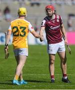 17 May 2025; Aodhan McGarry of Antrim and TJ Brennan after the Leinster GAA Hurling Senior Championship Round 4 match between Galway and Antrim at Pearse Stadium in Galway. Photo by John Sheridan/Sportsfile