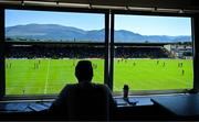 17 May 2025; The Kerryman journalist Paul Brennan watches as Conor Hand of Roscommon takes a free during the GAA Football All-Ireland Senior Championship Round 1 match between Kerry and Roscommon at Fitzgerald Stadium in Killarney, Kerry. Photo by Brendan Moran/Sportsfile