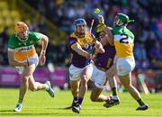 17 May 2025; Seamus Casey of Wexford in action against Ciaran Burke and Ben Conneely of Offaly during the Leinster GAA Hurling Senior Championship Round 4 match between Wexford and Offaly at Chadwicks Wexford Park in Wexford. Photo by Matt Browne/Sportsfile