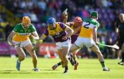 17 May 2025; Seamus Casey of Wexford in action against Ciaran Burkeof Offaly during the Leinster GAA Hurling Senior Championship Round 4 match between Wexford and Offaly at Chadwicks Wexford Park in Wexford. Photo by Matt Browne/Sportsfile