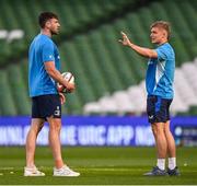 17 May 2025; Hugo Keenan, left, and Fintan Gunne of Leinster walk the pitch before the United Rugby Championship match between Leinster and Glasgow Warriors at the Aviva Stadium in Dublin. Photo by Ramsey Cardy/Sportsfile