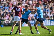 17 May 2025; Robert Finnerty of Galway and Dublin players Seán MacMahon and Theo Clancy, right, tussle during the GAA Football All-Ireland Senior Championship Round 1 match between Galway and Dublin at Pearse Stadium in Galway. Photo by Piaras Ó Mídheach/Sportsfile