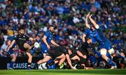 17 May 2025; Ben Afshar of Glasgow Warriors kicks under pressure from Jack Conan of Leinster during the United Rugby Championship match between Leinster and Glasgow Warriors at the Aviva Stadium in Dublin. Photo by Ramsey Cardy/Sportsfile