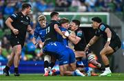 17 May 2025; Jordie Barrett of Leinster is tackled by Adam Hastings, left, and Rory Darge of Glasgow Warriors during the United Rugby Championship match between Leinster and Glasgow Warriors at the Aviva Stadium in Dublin. Photo by Ramsey Cardy/Sportsfile