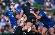 17 May 2025; Jordie Barrett of Leinster is tackled by Rory Darge, left, and Adam Hastings of Glasgow Warriors during the United Rugby Championship match between Leinster and Glasgow Warriors at the Aviva Stadium in Dublin. Photo by Ramsey Cardy/Sportsfile