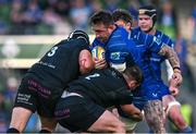 17 May 2025; Jack Conan of Leinster is tackled by Fin Richardson, left, and Seb Stephen of Glasgow Warriors during the United Rugby Championship match between Leinster and Glasgow Warriors at the Aviva Stadium in Dublin. Photo by Ramsey Cardy/Sportsfile