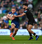 17 May 2025; Fintan Gunne of Leinster is tackled by Ben Afshar of Glasgow Warriors during the United Rugby Championship match between Leinster and Glasgow Warriors at the Aviva Stadium in Dublin. Photo by Ramsey Cardy/Sportsfile
