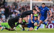 17 May 2025; Scott Penny of Leinster is tackled by Jare Oguntibeju and Rory Darge of Glasgow Warriors during the United Rugby Championship match between Leinster and Glasgow Warriors at the Aviva Stadium in Dublin. Photo by Ramsey Cardy/Sportsfile