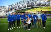 17 May 2025; Leinster players are presented with the Irish Shield by Billy Lacey, James Sherry and Lana Hill, representing OLSC charity Partner, Neurodiversity Ireland, during the United Rugby Championship match between Leinster and Glasgow Warriors at the Aviva Stadium in Dublin. Photo by Ramsey Cardy/Sportsfile