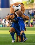 17 May 2025; Leo the Lion with Kyla Blake, aged 7, from Wicklow, before the United Rugby Championship match between Leinster and Glasgow Warriors at the Aviva Stadium in Dublin. Photo by Ramsey Cardy/Sportsfile