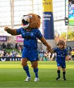 17 May 2025; Leo the Lion with Kyla Blake, aged 7, from Wicklow, before the United Rugby Championship match between Leinster and Glasgow Warriors at the Aviva Stadium in Dublin. Photo by Ramsey Cardy/Sportsfile