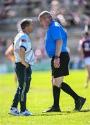 17 May 2025; Antrim manager Davy Fitzgerald in conversation with sideline official Peter Carroll before Fitzgerald was shown the yellow card by referee Thomas Gleeson during the Leinster GAA Hurling Senior Championship Round 4 match between Galway and Antrim at Pearse Stadium in Galway. Photo by Piaras Ó Mídheach/Sportsfile