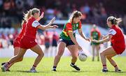 18 May 2025; Clíodhna Ní Shé of Carlow in action against Louth players, from left, Eilís Hand, Aoife Russell and Shannen McLaughlin during the TG4 Leinster LGFA Junior Championship final match between Carlow and Louth at TEG Cusack Park in Mullingar, Westmeath. Photo by Seb Daly/Sportsfile