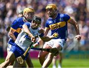 18 May 2025; Jamie Barron of Waterford is tackled by Ronan Maher, 6, and Conor Stakelum of Tipperary during the Munster GAA Hurling Senior Championship Round 4 match between Tipperary and Waterford at FBD Semple Stadium in Thurles, Tipperary. Photo by Ray McManus/Sportsfile