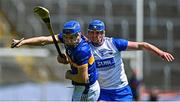 18 May 2025; John McGrath of Tipperary is tackled by Conor Prunty of Waterford during the Munster GAA Hurling Senior Championship Round 4 match between Tipperary and Waterford at FBD Semple Stadium in Thurles, Tipperary. Photo by Tyler Miller/Sportsfile