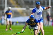 18 May 2025; John McGrath of Tipperary is tackled by Conor Prunty of Waterford during the Munster GAA Hurling Senior Championship Round 4 match between Tipperary and Waterford at FBD Semple Stadium in Thurles, Tipperary. Photo by Tyler Miller/Sportsfile