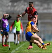 18 May 2025; Manus Doherty of Clare is tackled by Pat Havern of Down during the GAA Football All-Ireland Senior Championship Round 1 match between Clare and Down at Zimmer Biomet Páirc Chíosóg in Ennis, Clare. Photo by Tom Beary/Sportsfile