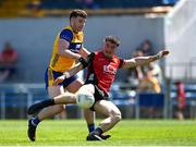 18 May 2025; Daniel Guinness of Down shoots to score his side's second goal despite the attention of Ronan Lanigan of Clare during the GAA Football All-Ireland Senior Championship Round 1 match between Clare and Down at Zimmer Biomet Páirc Chíosóg in Ennis, Clare. Photo by Tom Beary/Sportsfile