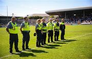 18 May 2025; Serving members of An Garda Síochána stand for a minute's silence in memory of the late Kevin Flatley, before the Leinster GAA Hurling Senior Championship Round 4 match between Kilkenny and Dublin at UPMC Nowlan Park in Kilkenny. Photo by Ramsey Cardy/Sportsfile