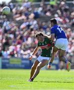 18 May 2025; Jordan Flynn of Mayo is tackled after passing the ball by Ryan Donohoe of Cavan during the GAA Football All-Ireland Senior Championship Round 1 match between Mayo and Cavan at Hastings Insurance MacHale Park in Castlebar, Mayo. Photo by Piaras Ó Mídheach/Sportsfile