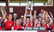 18 May 2025; Louth captain Áine Breen lifts the trophy after her side's victory in the TG4 Leinster LGFA Junior Championship final match between Carlow and Louth at TEG Cusack Park in Mullingar, Westmeath. Photo by Seb Daly/Sportsfile