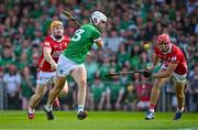 18 May 2025; Aaron Gillane of Limerick scores his side's first goal despite the efforts of Niall O'Leary, left, and Ciarán Joyce of Cork during the Munster GAA Hurling Senior Championship Round 4 match between Limerick and Cork at TUS Gaelic Grounds in Limerick. Photo by Sam Barnes/Sportsfile