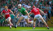 18 May 2025; Aaron Gillane of Limerick on his way to scoring his side's first goal despite the efforts of Ciarán Joyce of Cork, right, during the Munster GAA Hurling Senior Championship Round 4 match between Limerick and Cork at TUS Gaelic Grounds in Limerick. Photo by Sam Barnes/Sportsfile