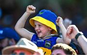 18 May 2025; A young Tipperary supporter celebrates a score during the Munster GAA Hurling Senior Championship Round 4 match between Tipperary and Waterford at FBD Semple Stadium in Thurles, Tipperary. Photo by Tyler Miller/Sportsfile