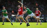 18 May 2025; Alan Connolly of Cork is tackled by Diarmaid Byrnes of Limerick during the Munster GAA Hurling Senior Championship Round 4 match between Limerick and Cork at TUS Gaelic Grounds in Limerick. Photo by Brendan Moran/Sportsfile