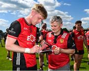 18 May 2025; Adam Crimmins of Down signs his autograph on the match programme of a supporter after the GAA Football All-Ireland Senior Championship Round 1 match between Clare and Down at Zimmer Biomet Páirc Chíosóg in Ennis, Clare. Photo by Tom Beary/Sportsfile
