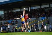 18 May 2025; Keelan Sexton of Clare and Pierce Laverty of Down contest a kickout during the GAA Football All-Ireland Senior Championship Round 1 match between Clare and Down at Zimmer Biomet Páirc Chíosóg in Ennis, Clare. Photo by Tom Beary/Sportsfile