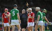 18 May 2025; Diarmaid Byrnes of Limerick is shown a yellow card by referee Liam Gordon after a foul on Alan Connolly of Cork during the Munster GAA Hurling Senior Championship Round 4 match between Limerick and Cork at TUS Gaelic Grounds in Limerick. Photo by Brendan Moran/Sportsfile