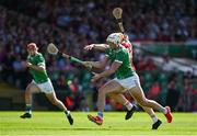 18 May 2025; Shane Barrett of Cor and Kyle Hayes of Limerick race for possession during the Munster GAA Hurling Senior Championship Round 4 match between Limerick and Cork at TUS Gaelic Grounds in Limerick. Photo by Brendan Moran/Sportsfile