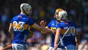 18 May 2025; Darragh McCarthy, 20, celebrates with Sean Kenneally and goalscorer Oisin O'Donoghue of Tipperary, left, during the Munster GAA Hurling Senior Championship Round 4 match between Tipperary and Waterford at FBD Semple Stadium in Thurles, Tipperary. Photo by Ray McManus/Sportsfile
