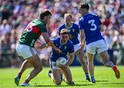 18 May 2025; Ciarán Brady of Cavan is tackled by Aidan O'Shea of Mayo during the GAA Football All-Ireland Senior Championship Round 1 match between Mayo and Cavan at Hastings Insurance MacHale Park in Castlebar, Mayo. Photo by Piaras Ó Mídheach/Sportsfile